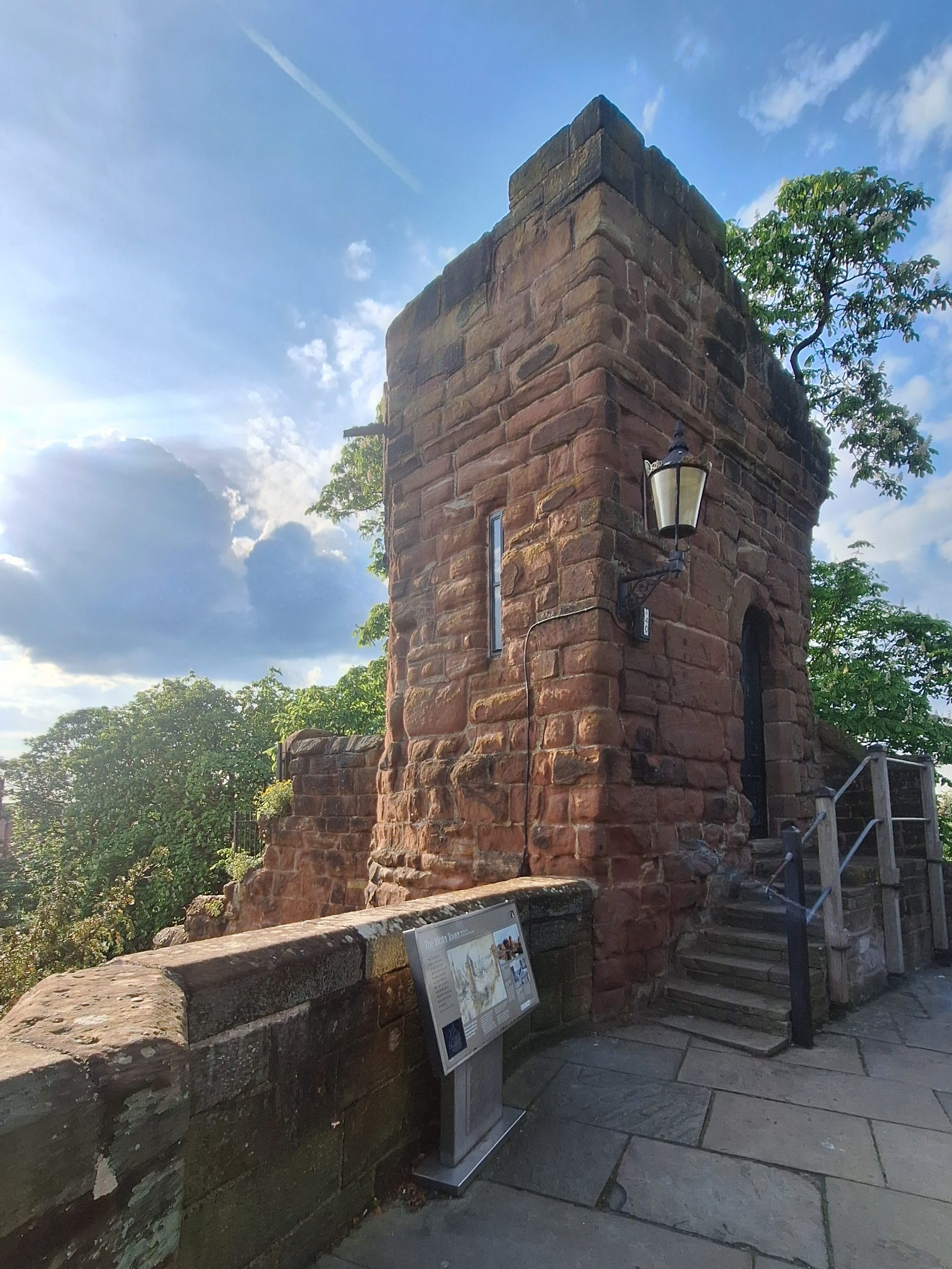 A Roma tower stands on the Chester city walls on a summer's day.