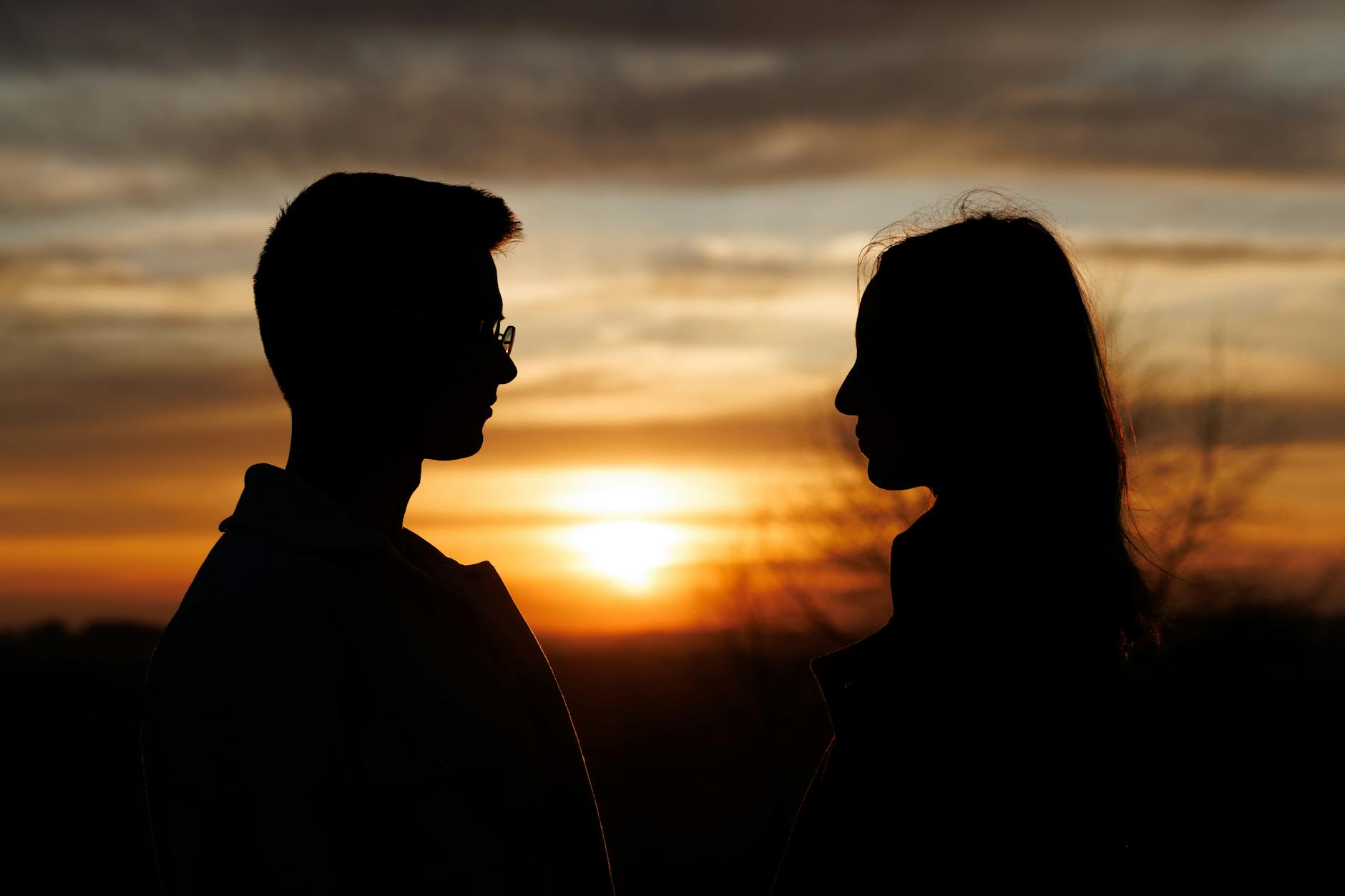 romantic silhouette of couple at sunset
